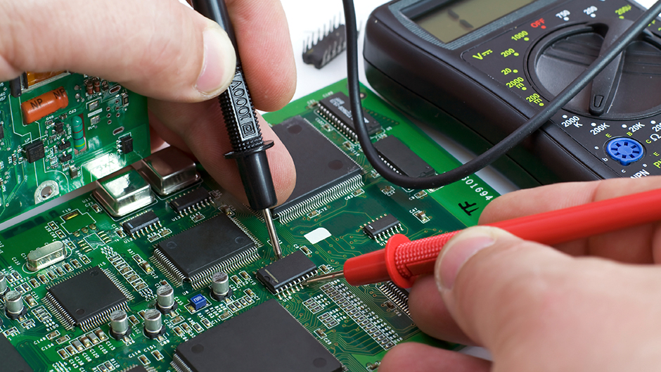 A person working on a computer chip
