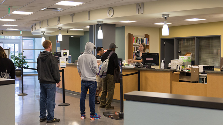 Students in line at the ARC Library Circulation desk